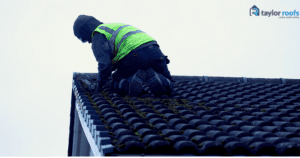 Roofer removing moss